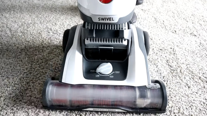 An Image of A Vacuum Cleaner Being Used on A Carpet